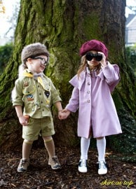 photo showing two cute kids dressed up in costumes